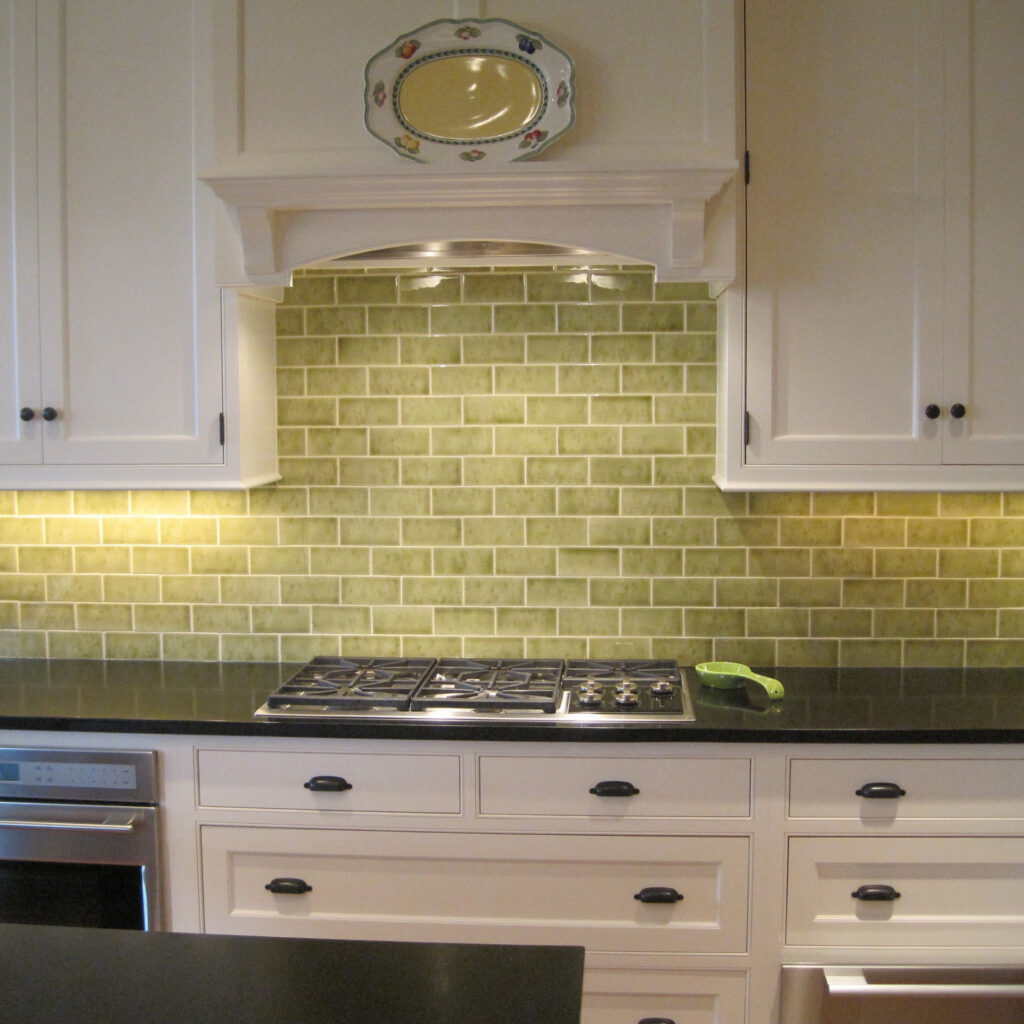 green subway tile backsplash