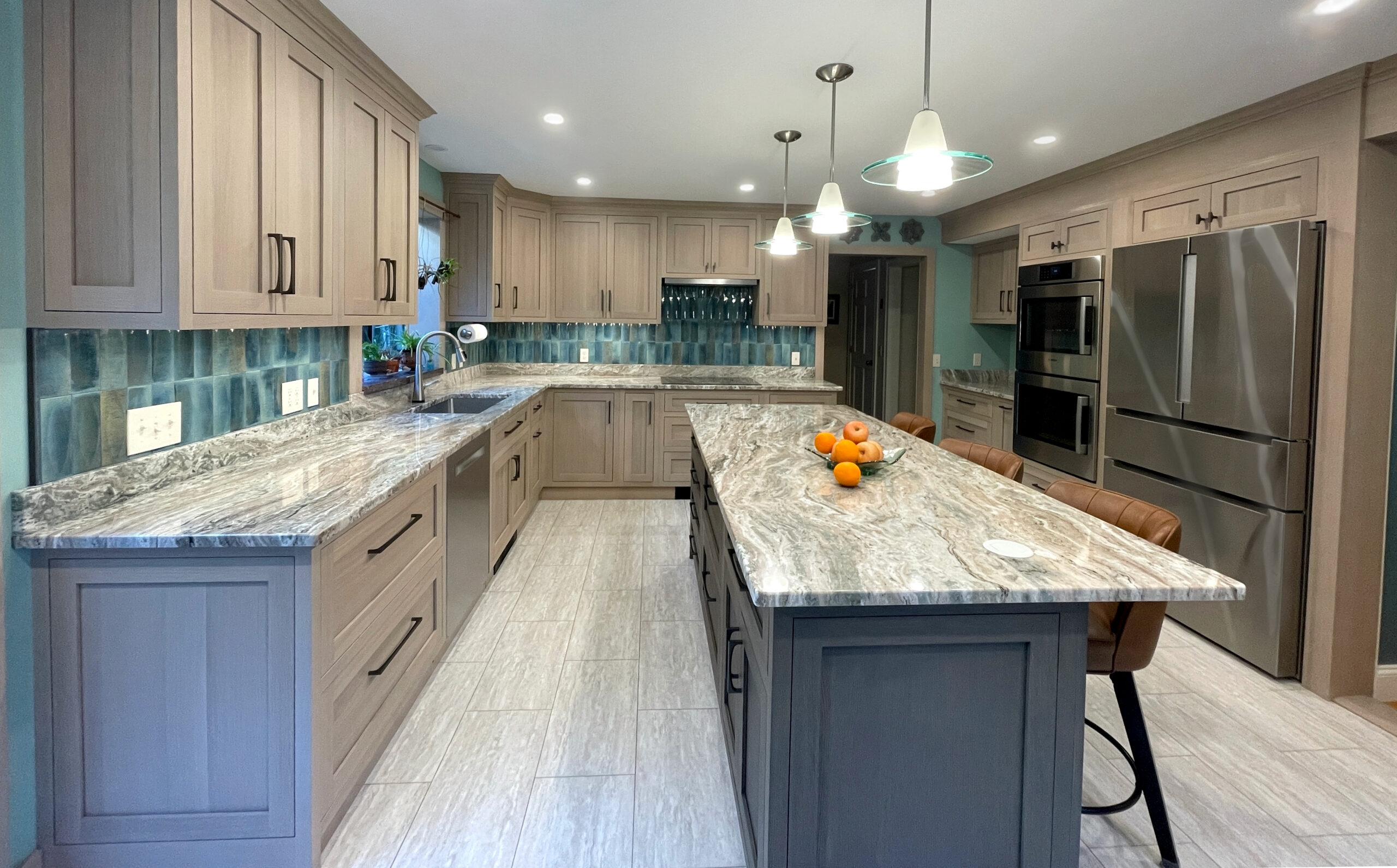 custom wall and base cabinets and countertops in a transitional style kitchen