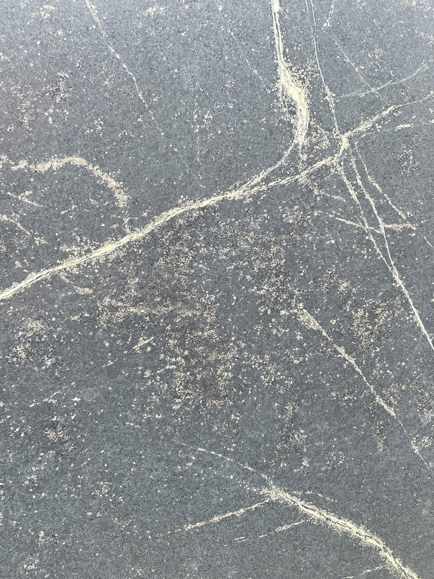 black soapstone slab with white streaks