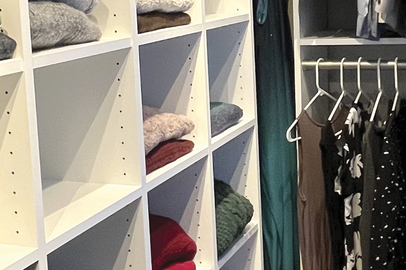 white open shelving in a closet