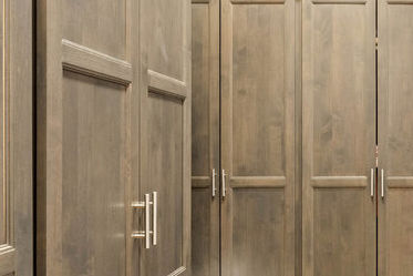 framed overlay cabinetry in a large storage room