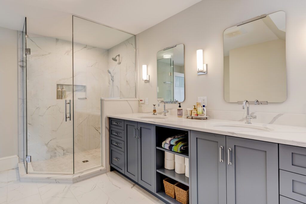 blue shaker style custom cabinets in a bathroom vanity